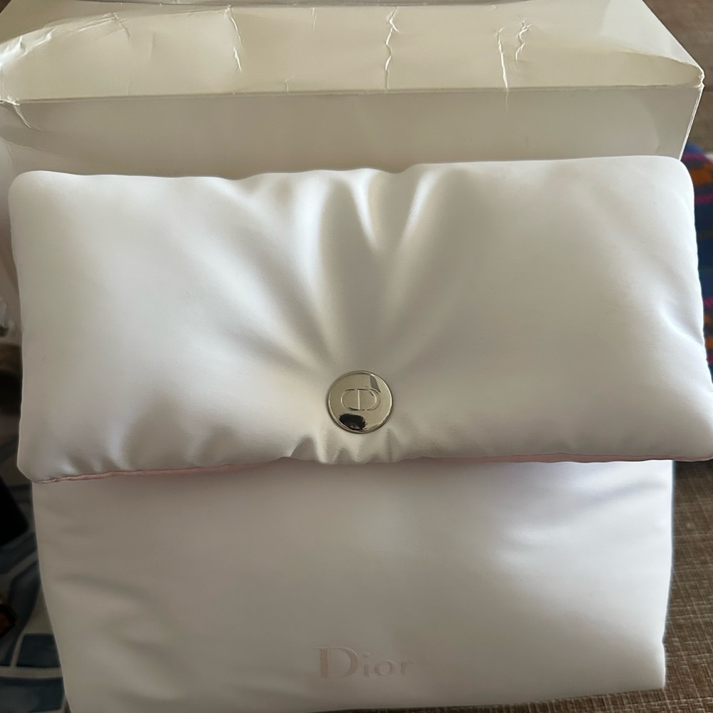 Christian Dior soft puffy cosmetic bag/pouch in white with a silver logo